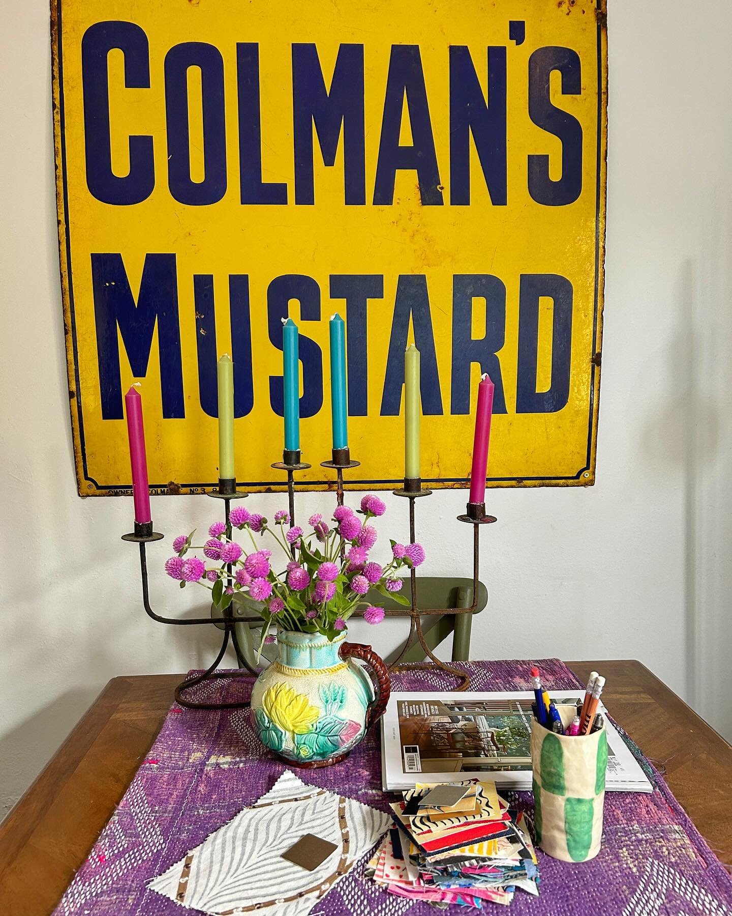 I need an inspirational view when working in my office and what better than this view - @ahundred.stories vintage Colman&rsquo;s Mustard sign, @thekingandidesign candlesticks with French candles from @the.little.candle.shop, the mauve flowers (no ide