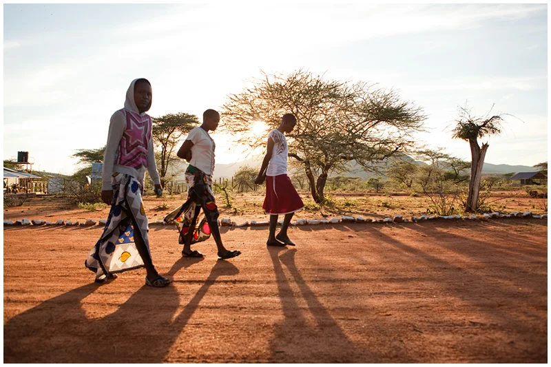 Early every morning the students are all expected to attend mass. here the girls walk from their dormitory to the chapel as the sun rises. 