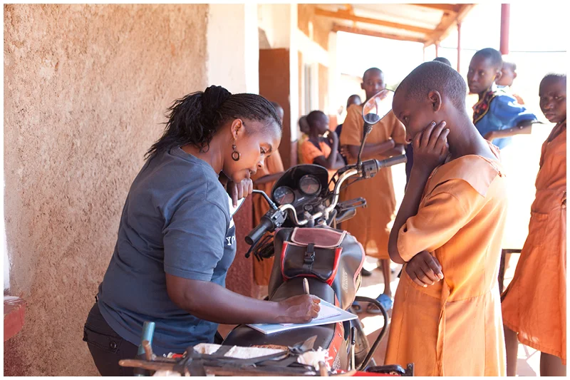Kate is the social worker at Expanding Opportunities and she is chatting to the various girls they support to find out how they are doing at school and what they need for the coming term. 