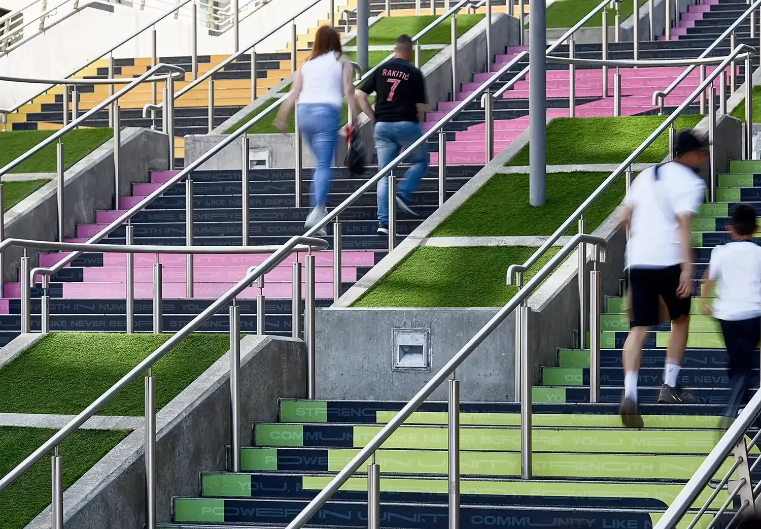 Close-up of the Spanish Steps installation at Wembley Park featuring bold typographic messaging as part of the “Against the Odds” public artwork for Euro 2020.