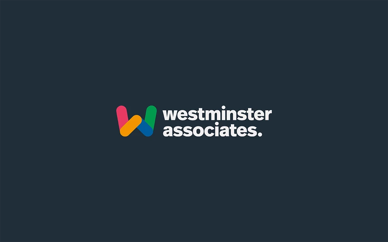 Westminster Associates logo featuring a multicolored letter 'W' and the company name in white text on a dark background.
