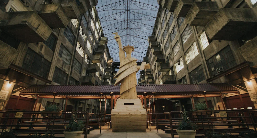 Wooden Statue designed by Pedro Reyes.