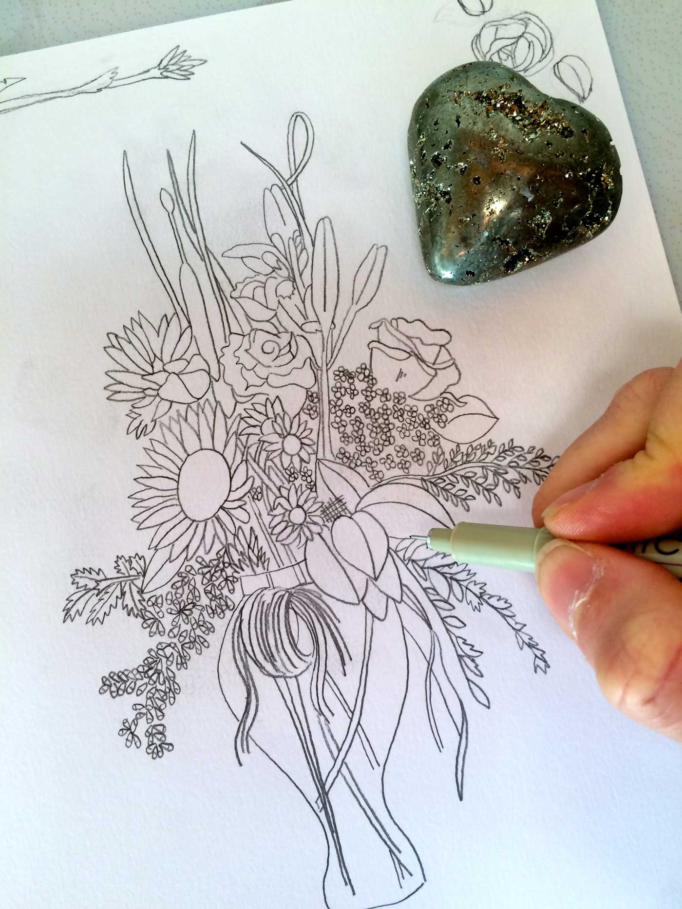Inking over the pencil.