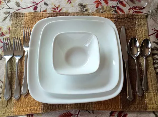For this example I used some every day white plates but you can have lots of fun mixing and matching to your heart's content. See how the setting can even make everyday dishes look fancy? Also note the placemat and tablecloth were purchased separately but they still go together (thanks, mom!)