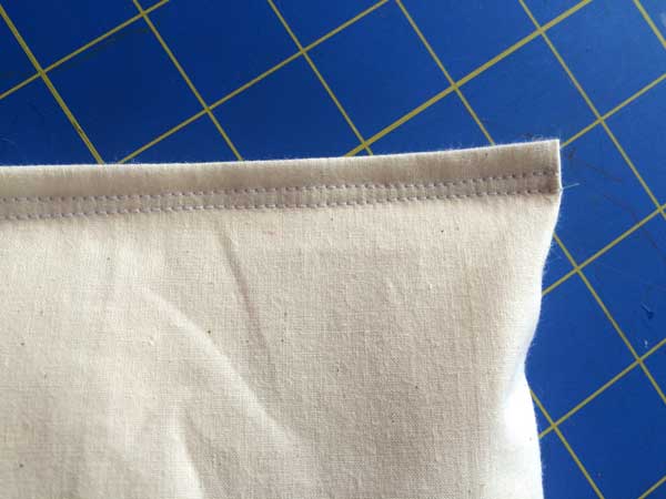 Double reinforcements!!! Do an upside down test shake to make sure it's secure and no rice falls out. Now if you have opted to not make a cover and have used a decorative piece of fabric for this part, you are all done!! If you have the option to make decorative stitches on your machine, that would add a nice finishing touch to the top.