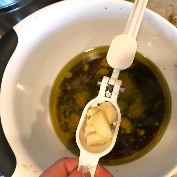 Now add your 2 (or to your liking) cloves of garlic. I run mine through the garlic press but they can just be chopped up a little. Add some salt and pepper to your liking.