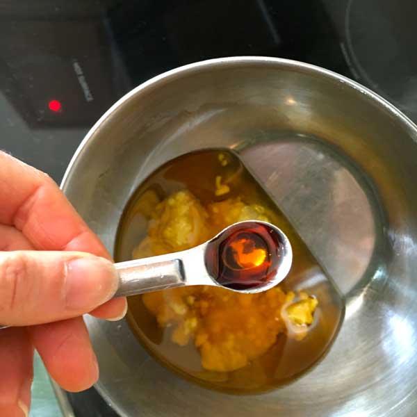 Add the 1/2 tsp. vitamin E oil.