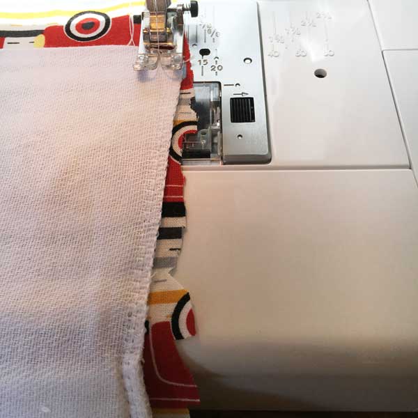 Sew around the perimeter of the diaper cloth, close to the edge. When you are finished, trim any excess fabric around the edges being careful not to cut any of the lines you just sewed.