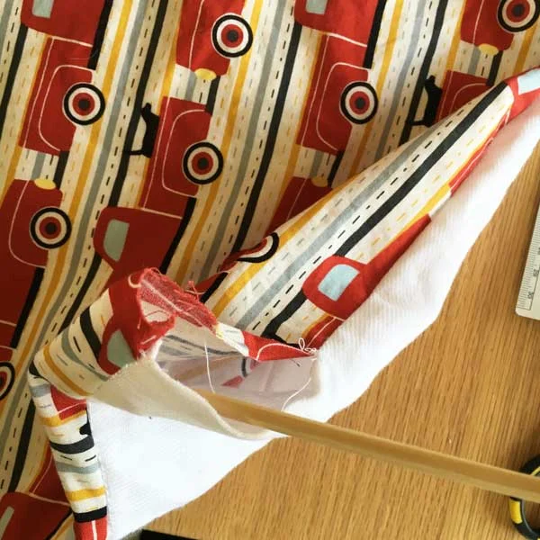 You can use a chopstick to gently push out the corners.