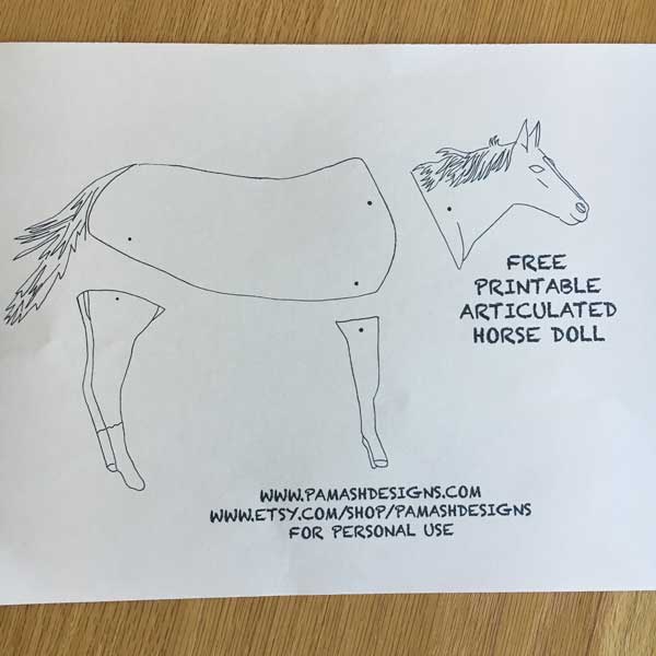 First, print out your free PDF file. I would recommend printing this on some heavy white paper so your doll will be a little more sturdy (some white cardstock). If you plan on using watercolor, you may want to print on watercolor paper. I printed on a heavy weight construction paper.