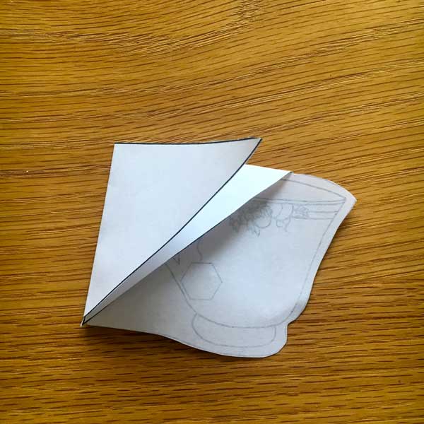 Next, fold the other triangle down to make a pocket.