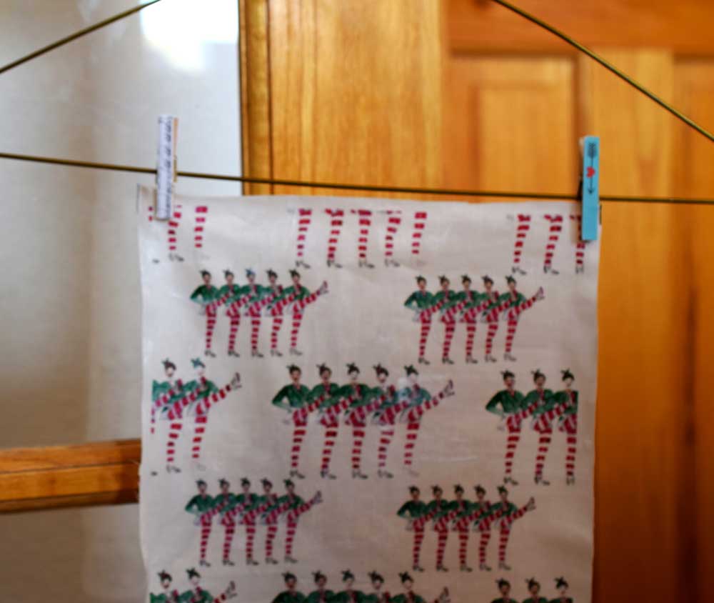 You can leave your fabric flat to dry. I hung mine up on a hanger with some wooden clips.