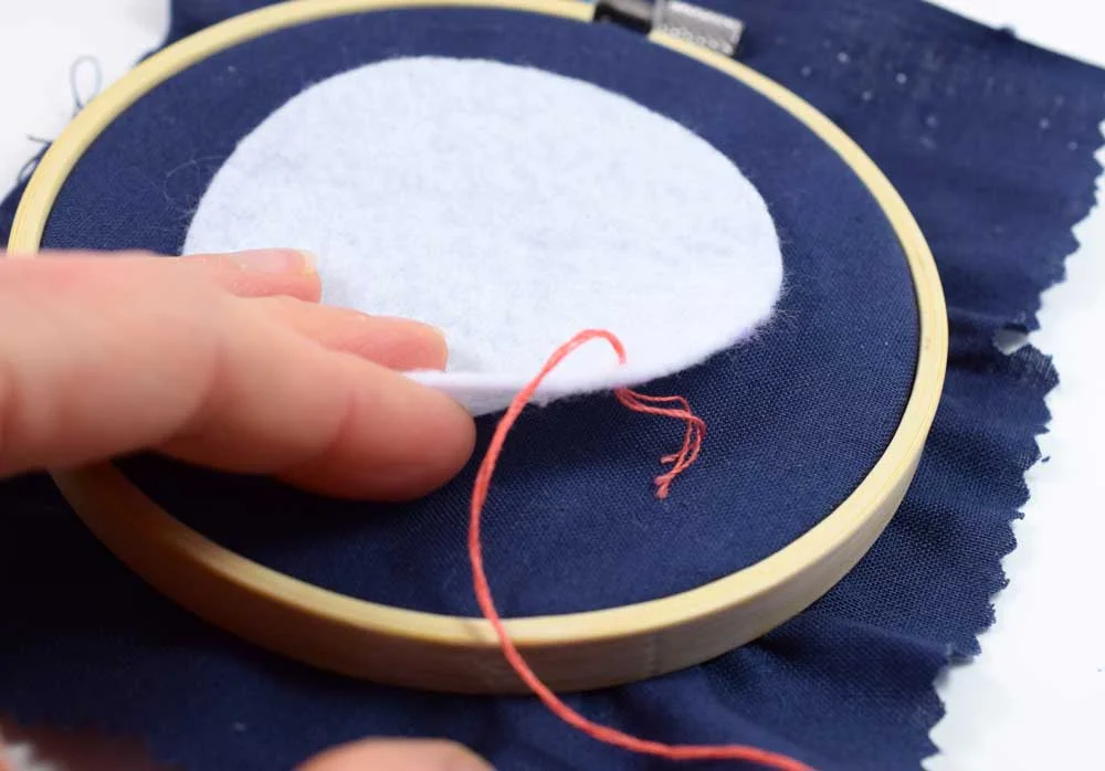 Hide the knot in the back of the felt.