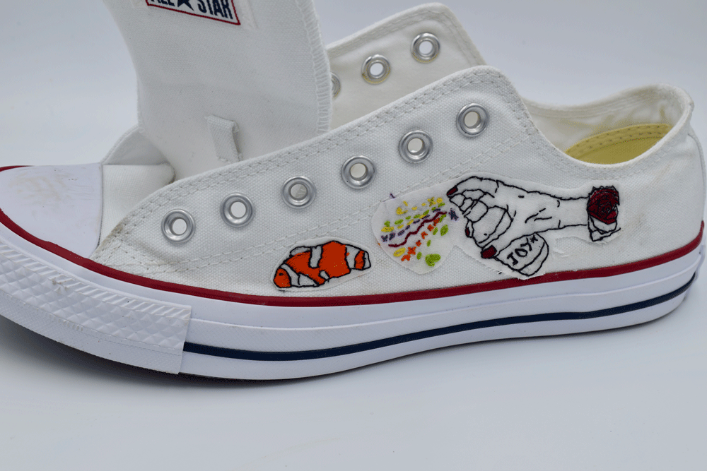 Here are the designs ironed on to the sneaker. I placed the side of the sneaker on the narrowest part of my ironing board and ran the iron over the design until it it was firmly attached.
