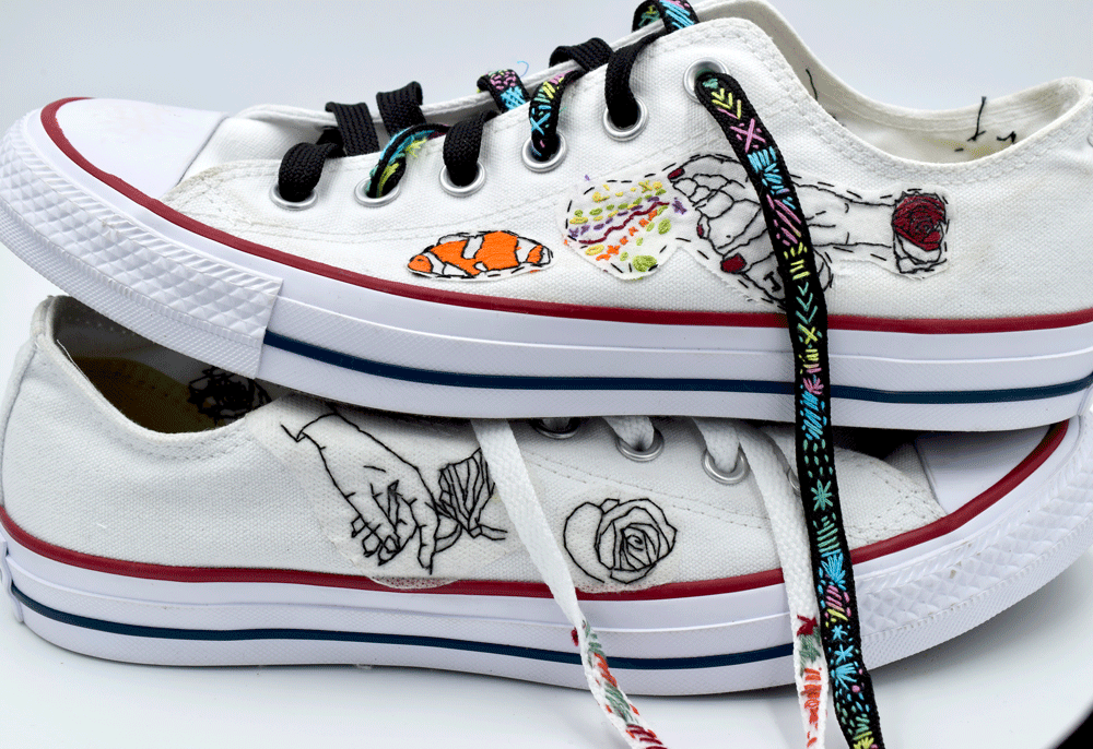 I finished by stitching around the edge of the designs with a black thread. I thought the black shoe laces were a fun twist.