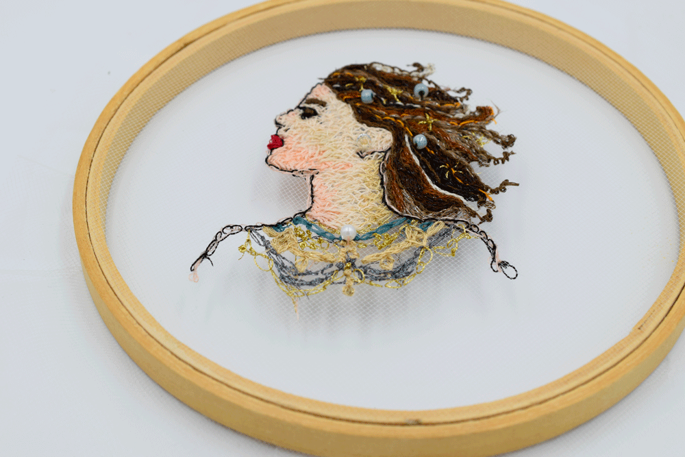 I placed the tulle back in the hoop and gently tightened it. Be very gentle. This stuff tears really easily.