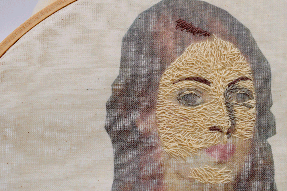 I start filling in her whole face. I am treating this in a painterly fashion by laying down the lightest color I see first with the plan of going in later and adding layers of color and highlights. I change the direction of the thread to help shape the face.
