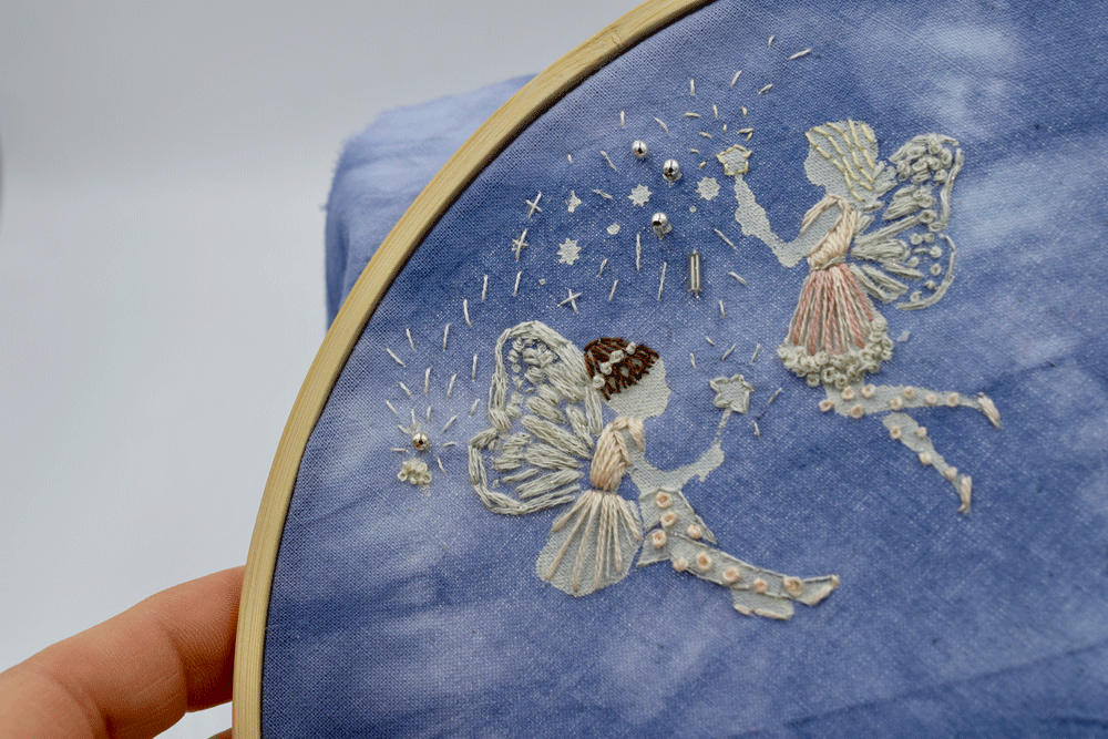 I jumped back and finished the fairies. I added a few beads. I may go back and add more seed stitches.