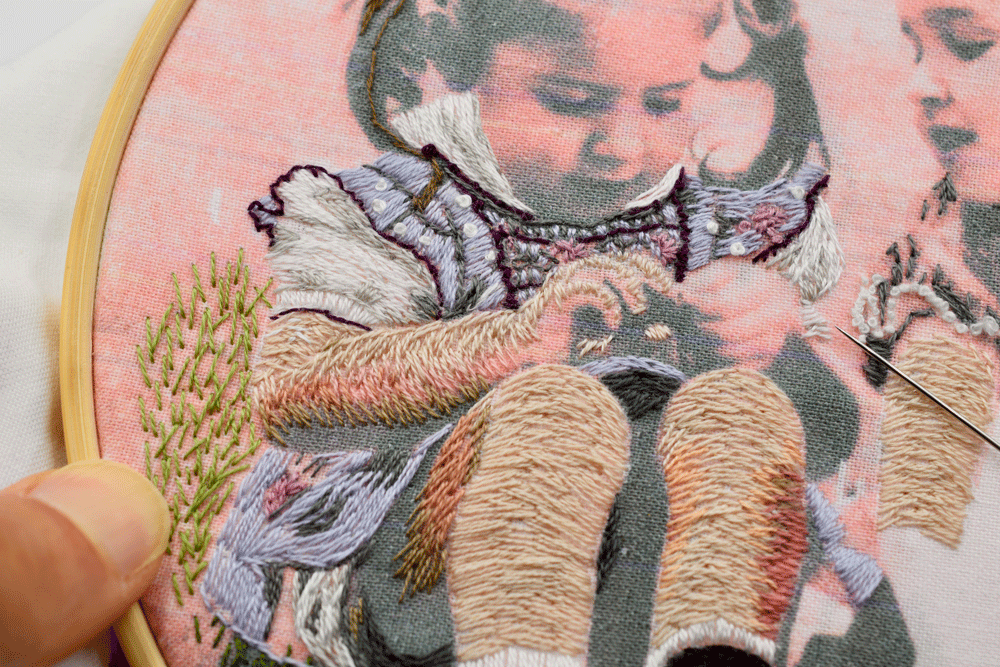 I tried my best to imagine what the dress looked like and added a violet trim, tiny pink flowers, and white polka dots.