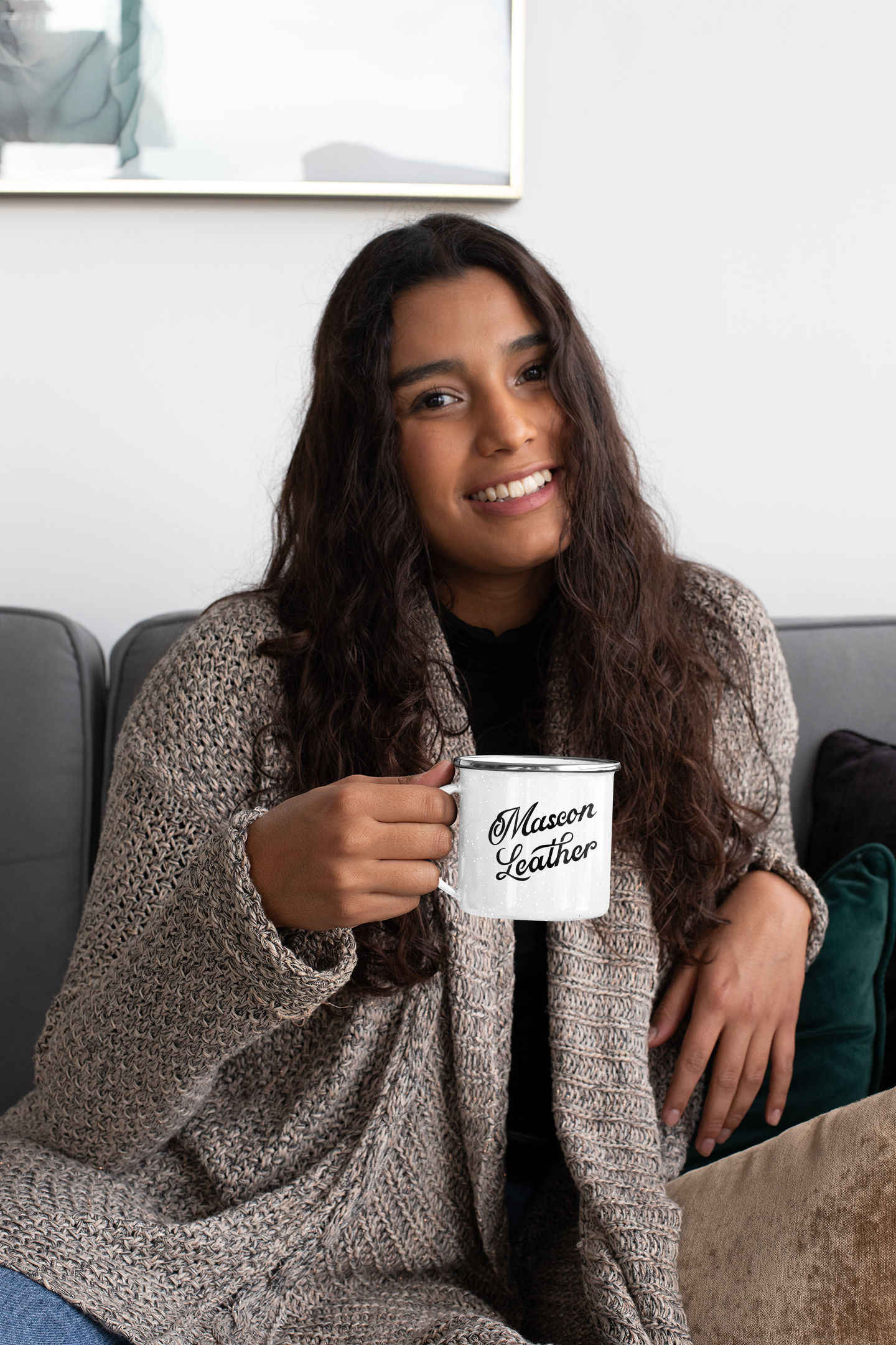 12-oz-enamel-mug-mockup-featuring-a-woman-sitting-on-a-couch-30827a.png