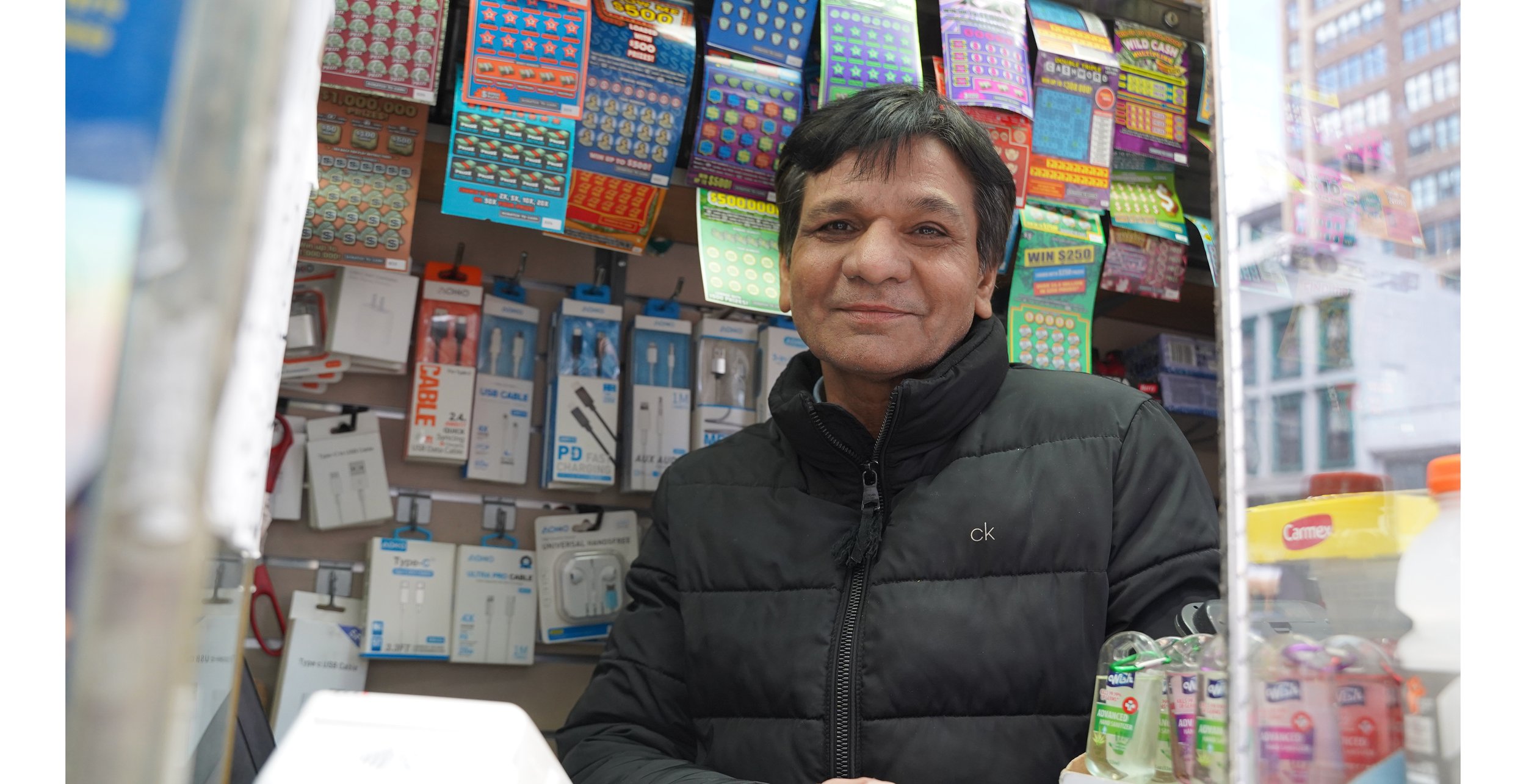 Peter works in a newsstand over on the next block. I never even saw it was there until I walked by it with my camera. He was so nice and give me his warmest smile. We took several pictures.