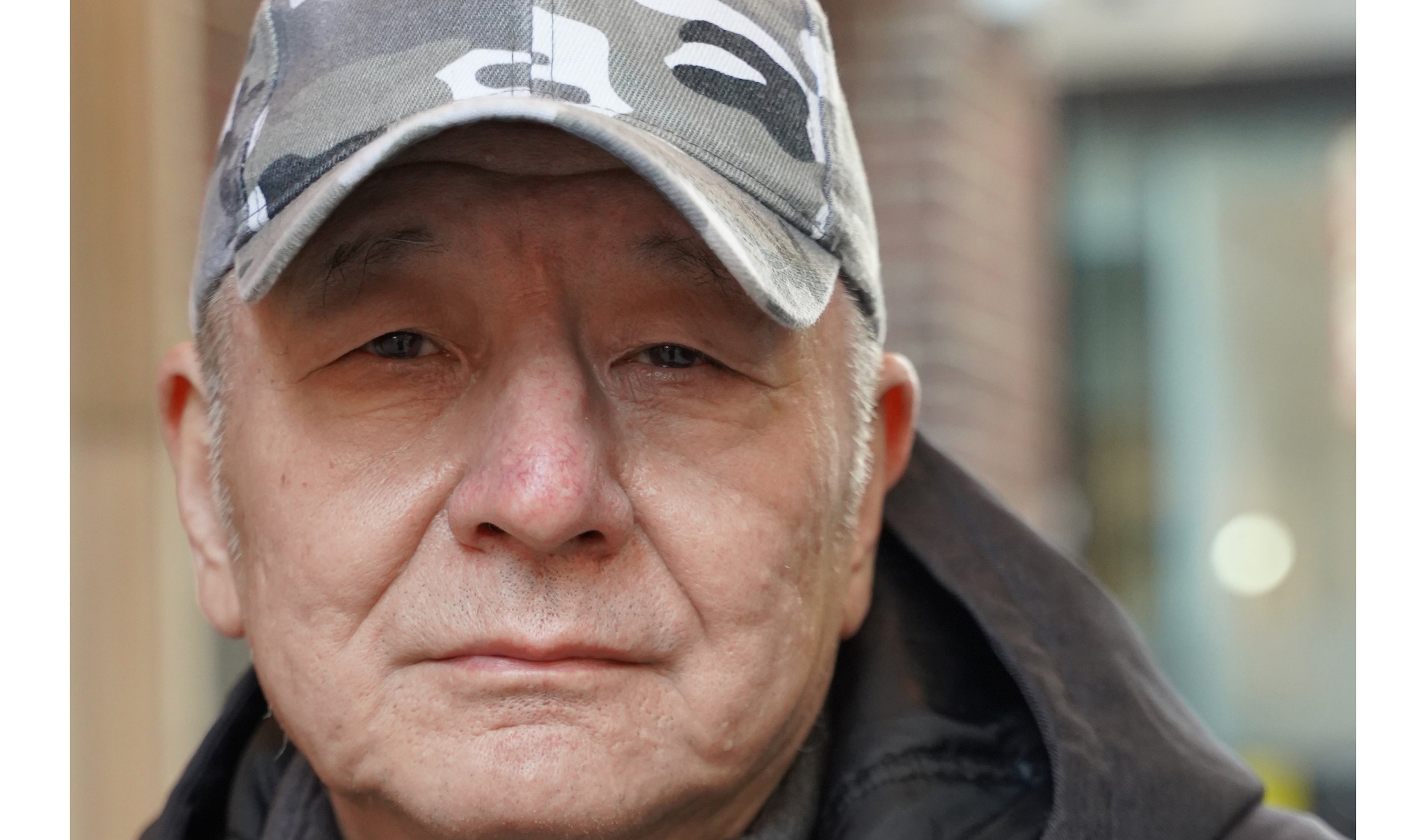 He stopped his bike to let me take his photo, and never said a word but his name. It's Jason. 