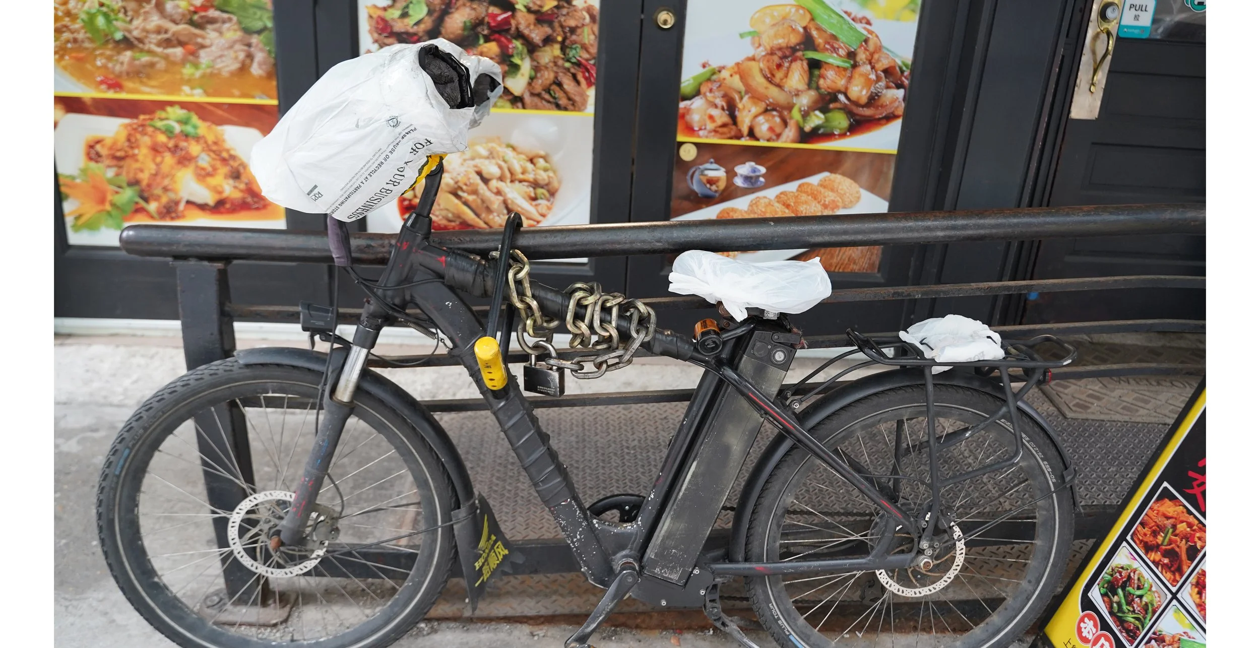 Bike messengers put plastic bags on the handlebars to keep their hands warm in inclement weather. 