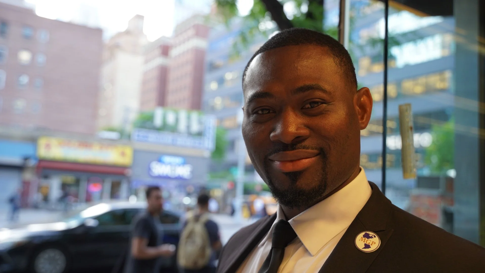 Emeka is from Nigeria and can identify a person's tribe by their last name. He buttoned his suit for the photo :-)