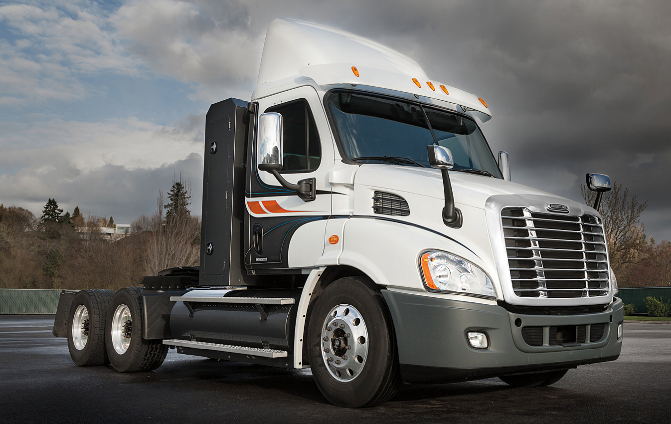 A Freightliner Cascadia powered by a 12L Cummins engine and equipped with an Agility Fuel Systems CNG storage system mounted behind the cab and on the frame rails