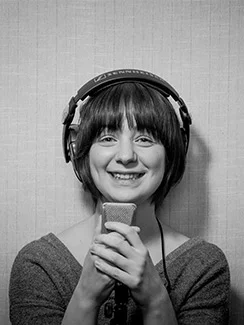 Caitlyn Bairstow | Talent Coordinator, Production Assistant   Once you’ve gained passage through the impenetrable "Buzz Door", and scaled the treacherous front stairs, you will be greeted by a tiny bear in short shorts. This is Caitlyn. Many years ago, we made the mistake of feeding this weak and malnourished BCIT intern, and from that day forward we could never get rid of her. Nowadays, she herds the talent, socials the media, and performs many other important business-like tasks.