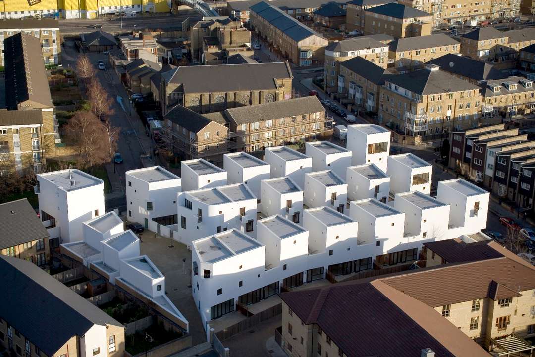 As cities around the world struggle with solutions to the housing shortage that faces many communities, one urban building typology has been floated for decades that might increase housing units without reducing quality of life: low-rise, high-density. Emerging in the 1960s and 70s as an antidote to the severe “tower in the park” model offered by Le Corbusier and others, this housing typology had the potential to overcome some of the downsides of massive urban renewal in its emphasis on livable scale and community context.
