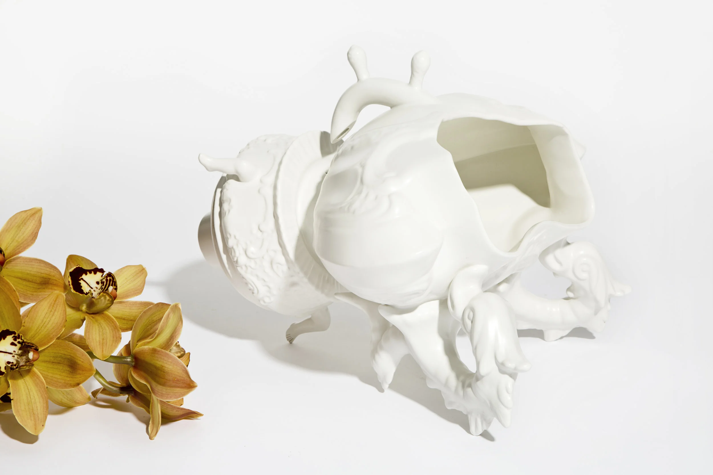 METAFORMA Paolo Polloniato for Editamateria Different fragments become surrealist forms Metaforma is the result of the metamorphosis of thought into matter. The project fuses models found in Belgium with traditional Italian designs, eliminating their old functions and creating something entirely new. “The sculpture comes from a personal approach to the practice of ceramics. The history of the city where I live is deeply connected with the evolution of the art form, that has existed for more than three centuries” – Paolo Polloniato Paolo Polloniato’s respect for his family’s long-history of ceramics is shown through his passionate work which combines traditional Nove practices with his own unique artist vision. “Following the fusion between artist and craftsman - guiding them, accompanying them and supporting them - is part of my work. - Silvia Ariemma, Editamateria. Paolo Polloniato is the last scion of a dynasty of master craftsmen who have been dedicating their lives, since the early XIX century, to the ceramic tradition of Nove, with a contemporary approach. Editamateria works on the relationship between creativity and the culture of know-how he collection stems from Italian designers’ excellence in craftsmanship and the shaping of unique design insights to capture the preciousness of objects that have been hand-crafted by man.