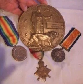 Alfred Lambert's medals and memorial plaque.