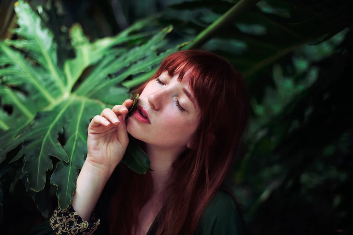 Portrait of a redhead model with plants