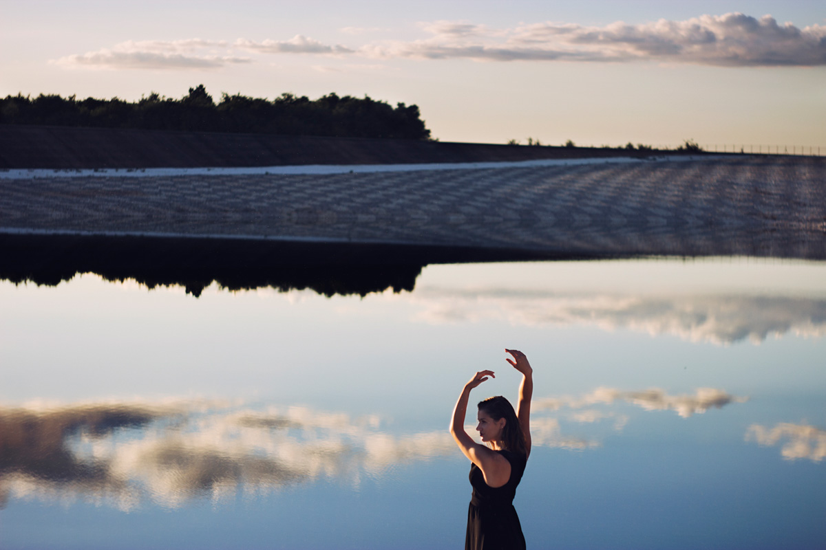 Girl with clouds in a lake