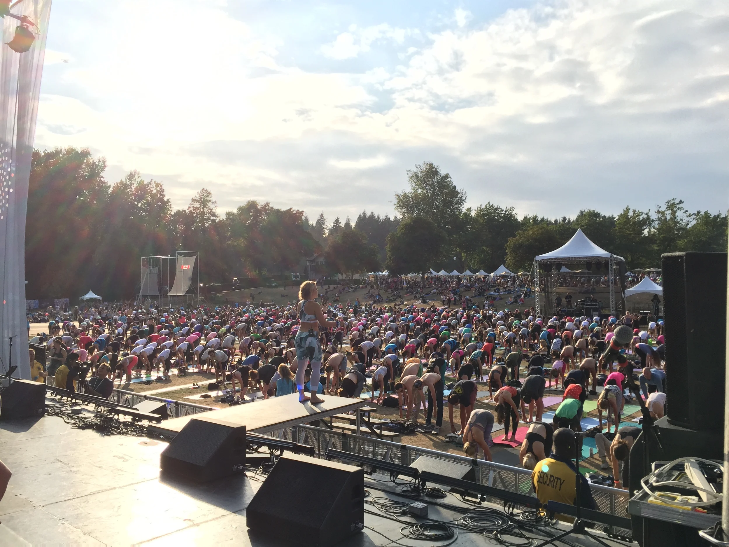 Thousands participate in Sunset Yoga with the fabulous Alex Mazerolle.