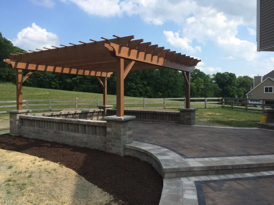 Unilock patio, seat walls, pillars, and custom pergola in Warwick, NY. 