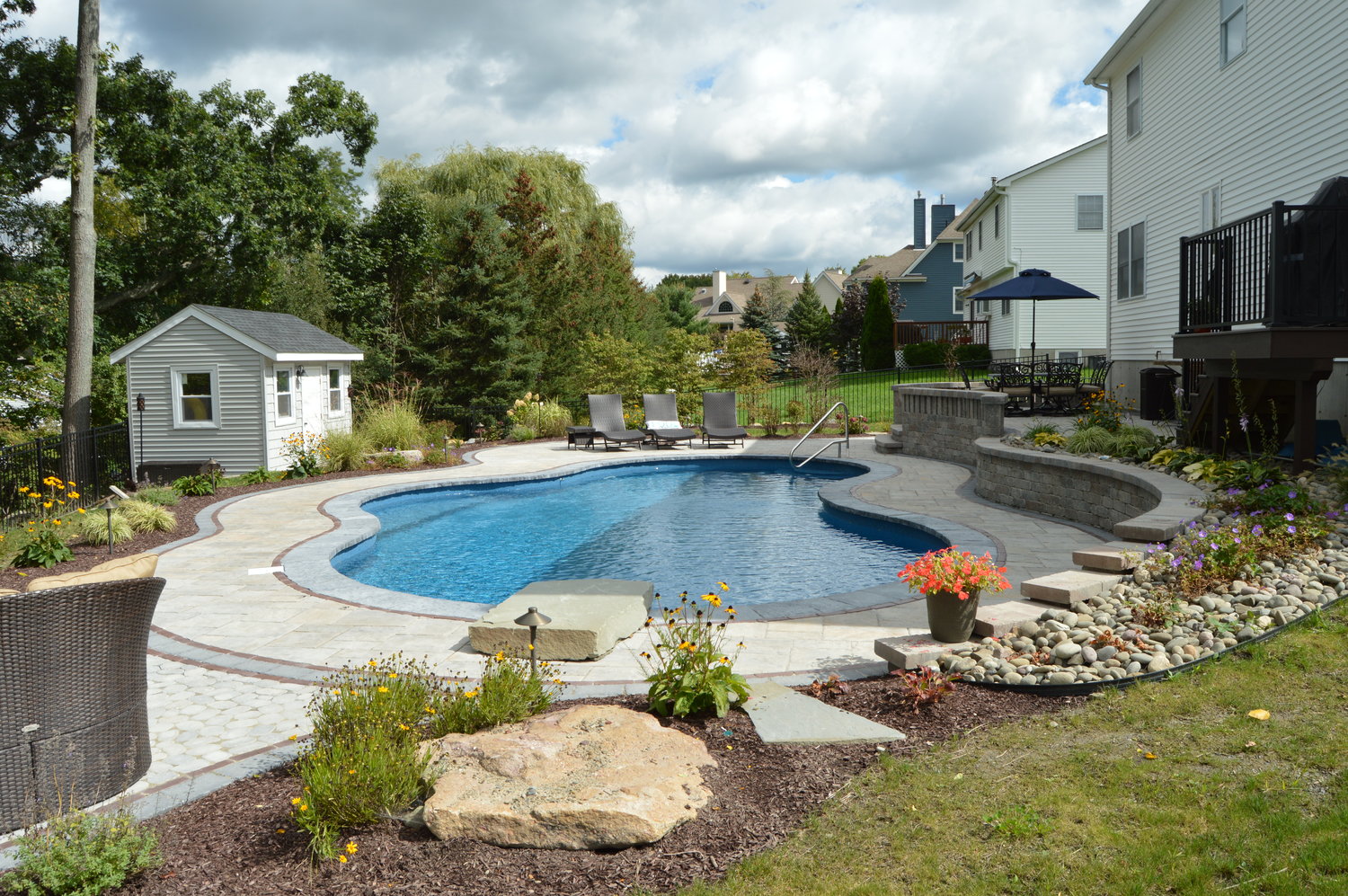 spruce up your swimming pool this summer with these landscape