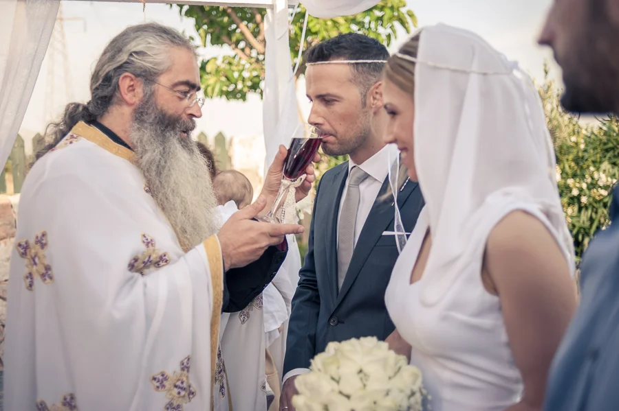 41_Wedding_In_Athens_Koropi_groom_wine.jpg