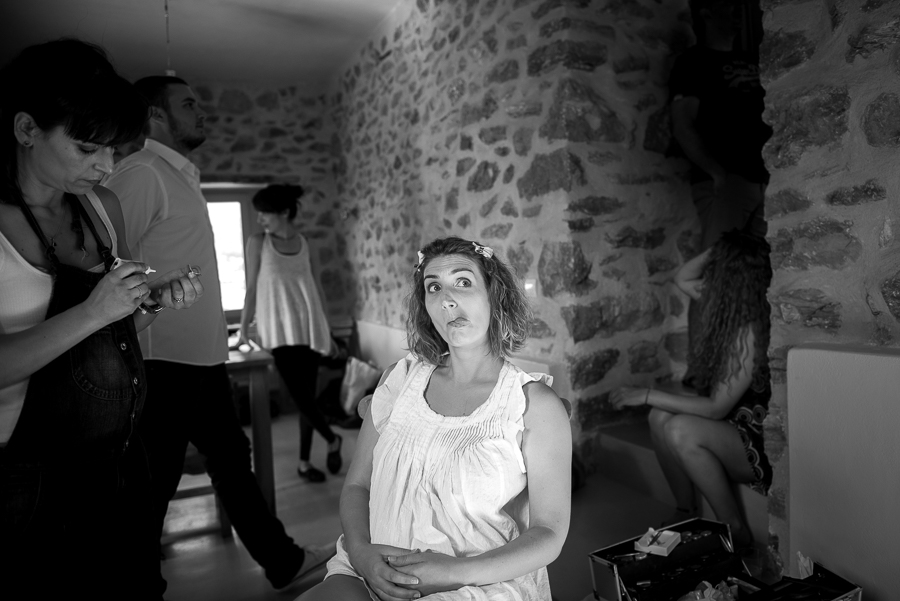 23_Wedding in Folegandros bride doing face.jpg