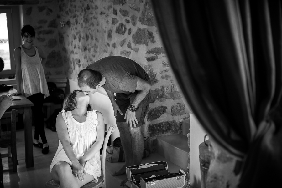 24_Wedding in Folegandros bride kisses groom.jpg