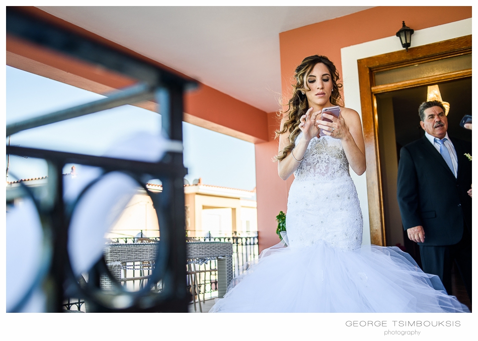 85_Wedding in Chios brides phone.jpg