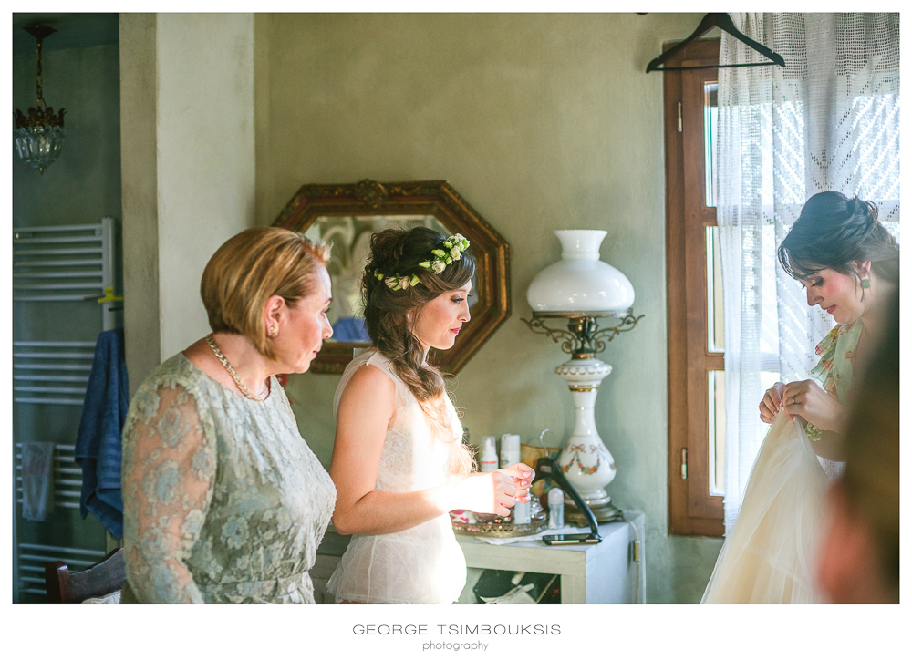 88_Wedding in Mystras_putting the wedding dress.jpg