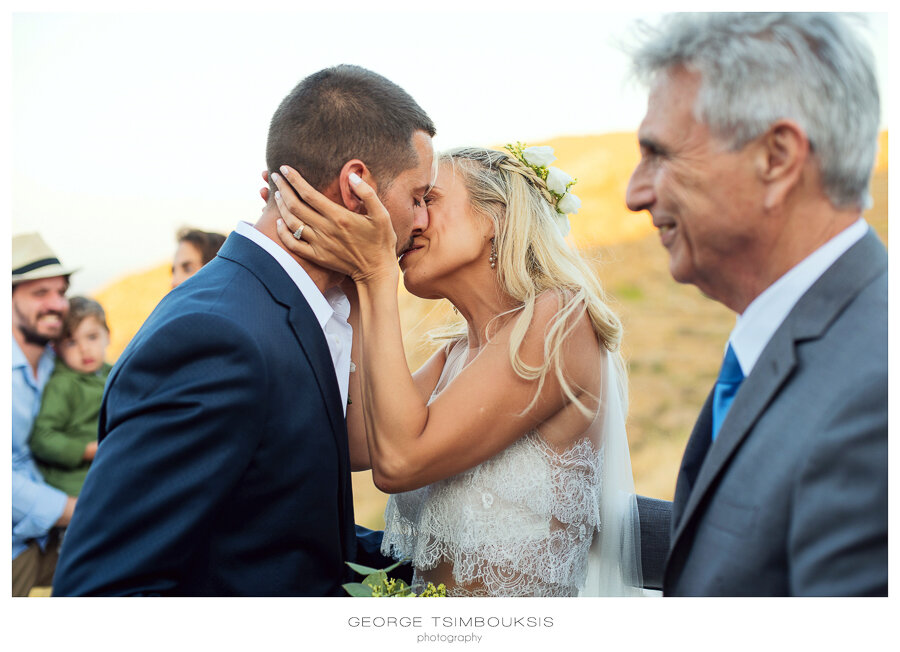 46_ Bride and groom kiss.JPG