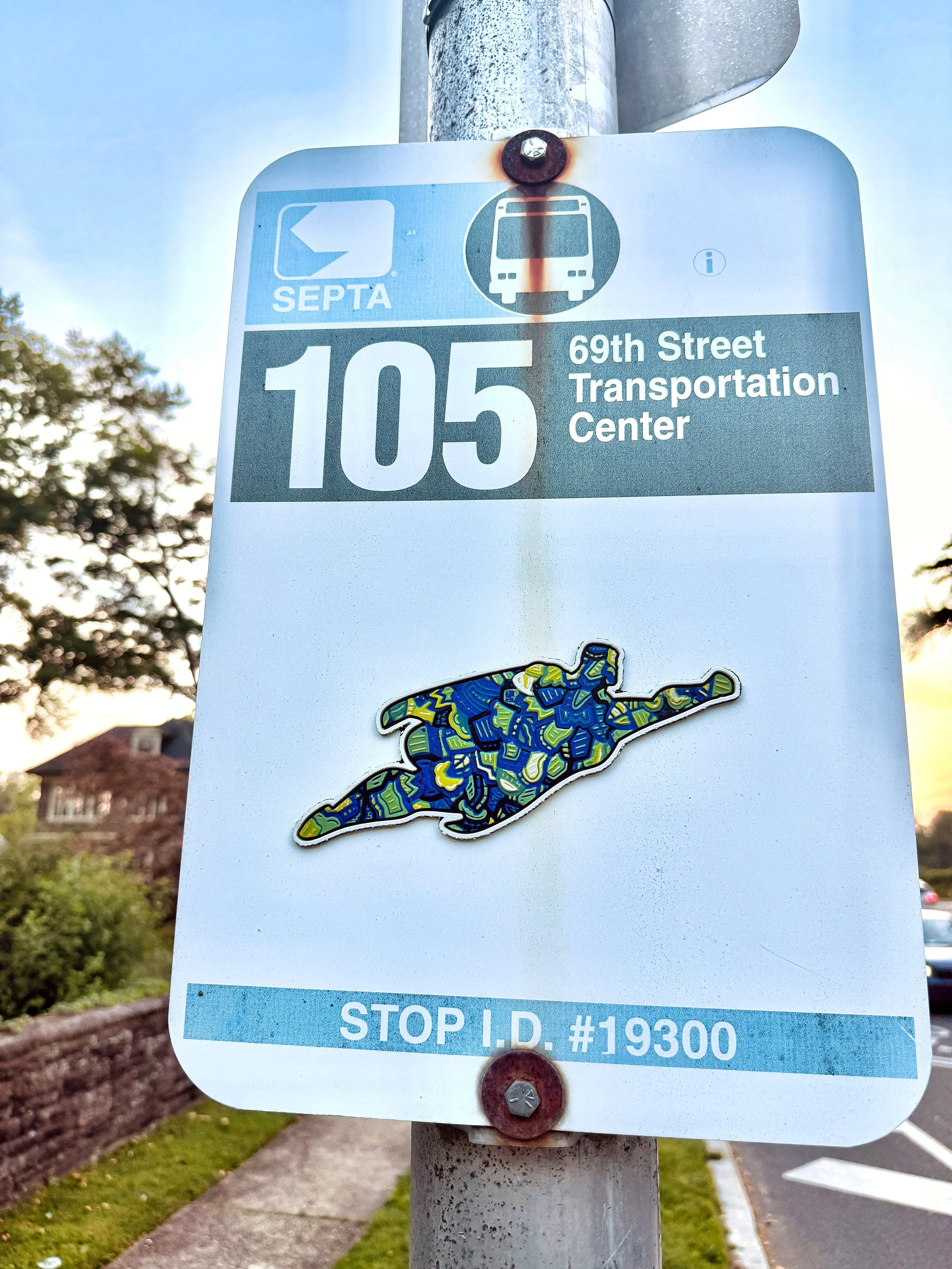 Cultures By Dezign - 105 Bus Superhero in West Philly (3-D Printed Street Art)