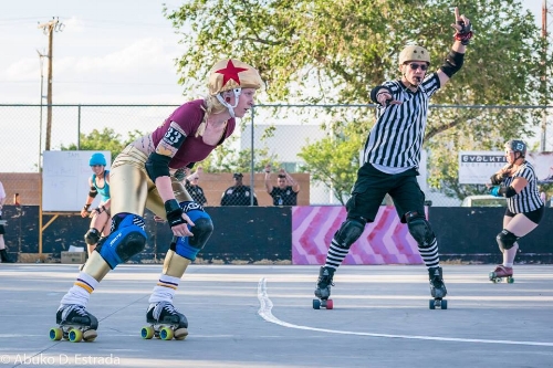 Fowl Play declares DCRD's BeeBop lead jammer at a 2016 home team bout. Photo by Abuko D. Estrada 