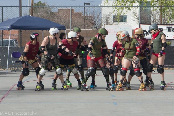Hazard (in green, second Dame from the right) suited up with the Dooms Dames for her first bout in March. Photo by M.A.L. Photography. 