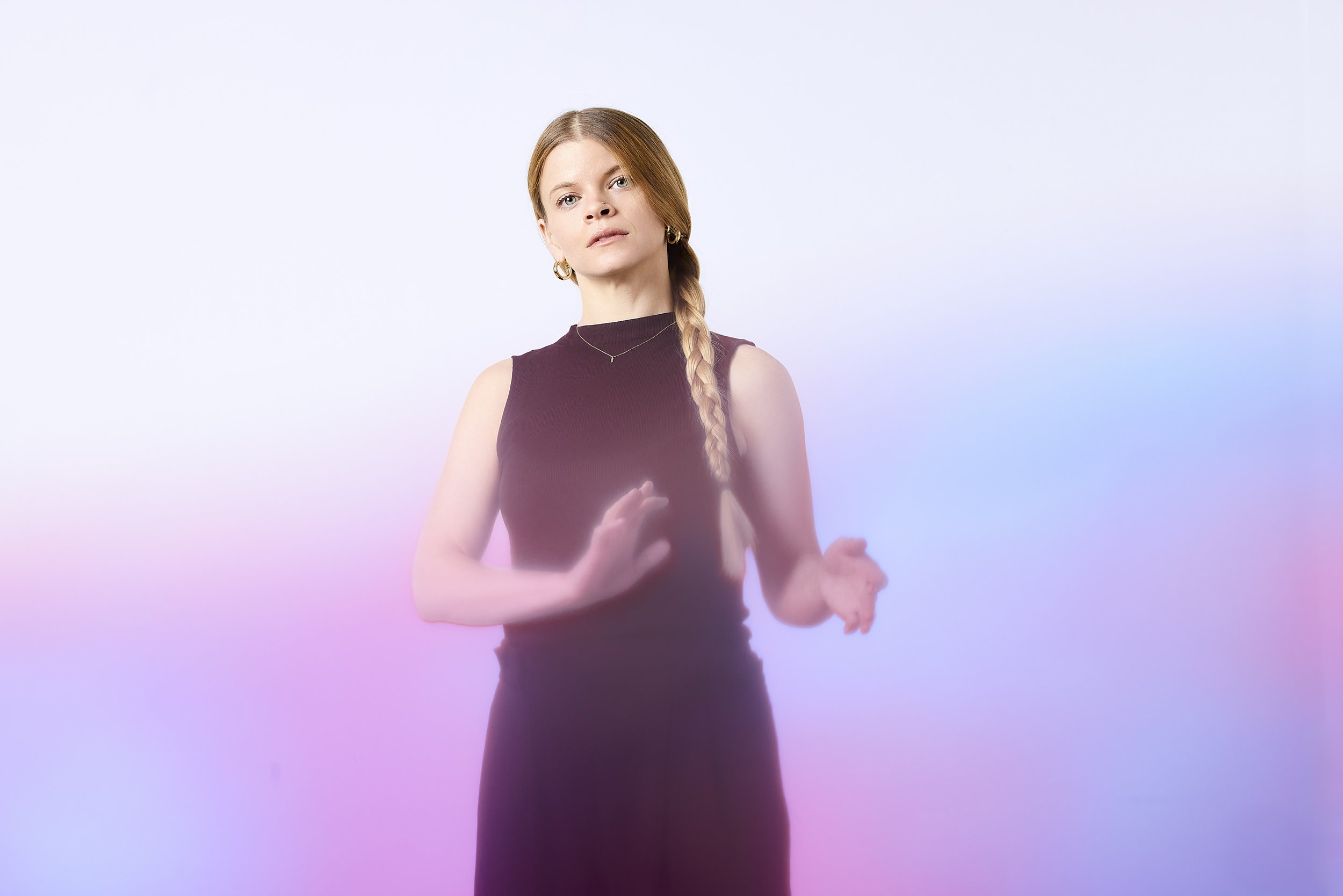 Laura Cocks flute poses pink and purple background