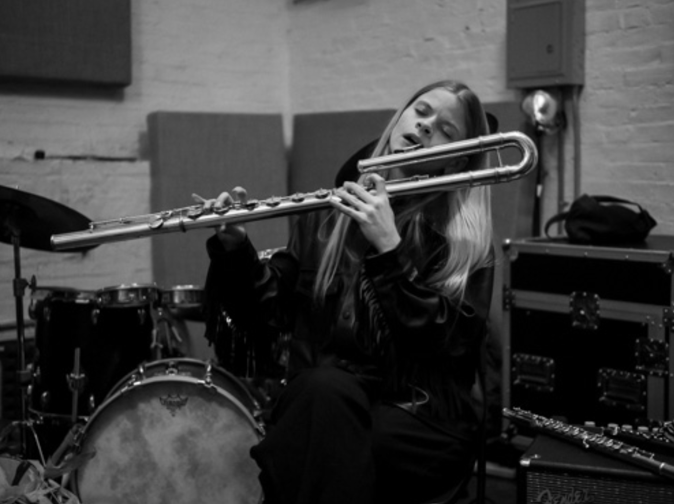 Laura Cocks flute photograph in black and white playing bass flute