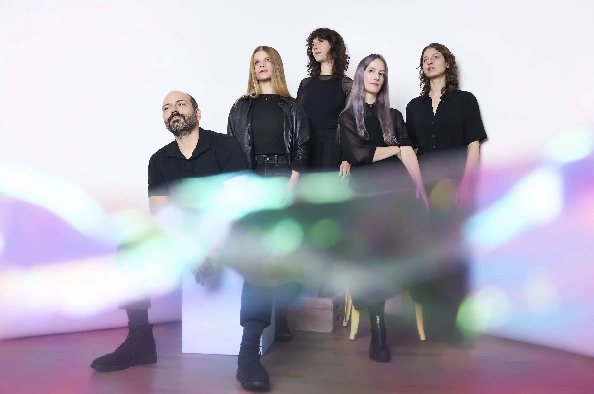 TAK ensemble in front of white background with purple streaks - Laura Cocks flute, Charlotte mundy, madison greenstone, ellery trafford, marina kifferstein